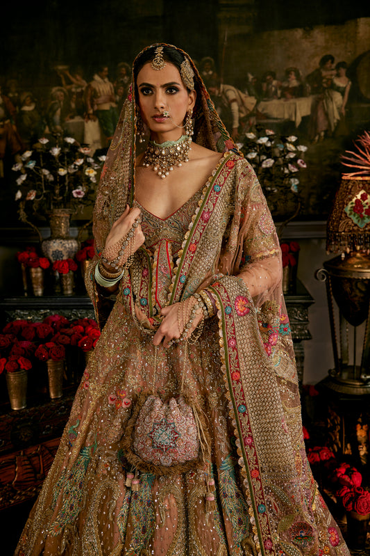 An Earthy Blush Pink Tulle Lehenga Paired With an Illusion Tie-Up Choli